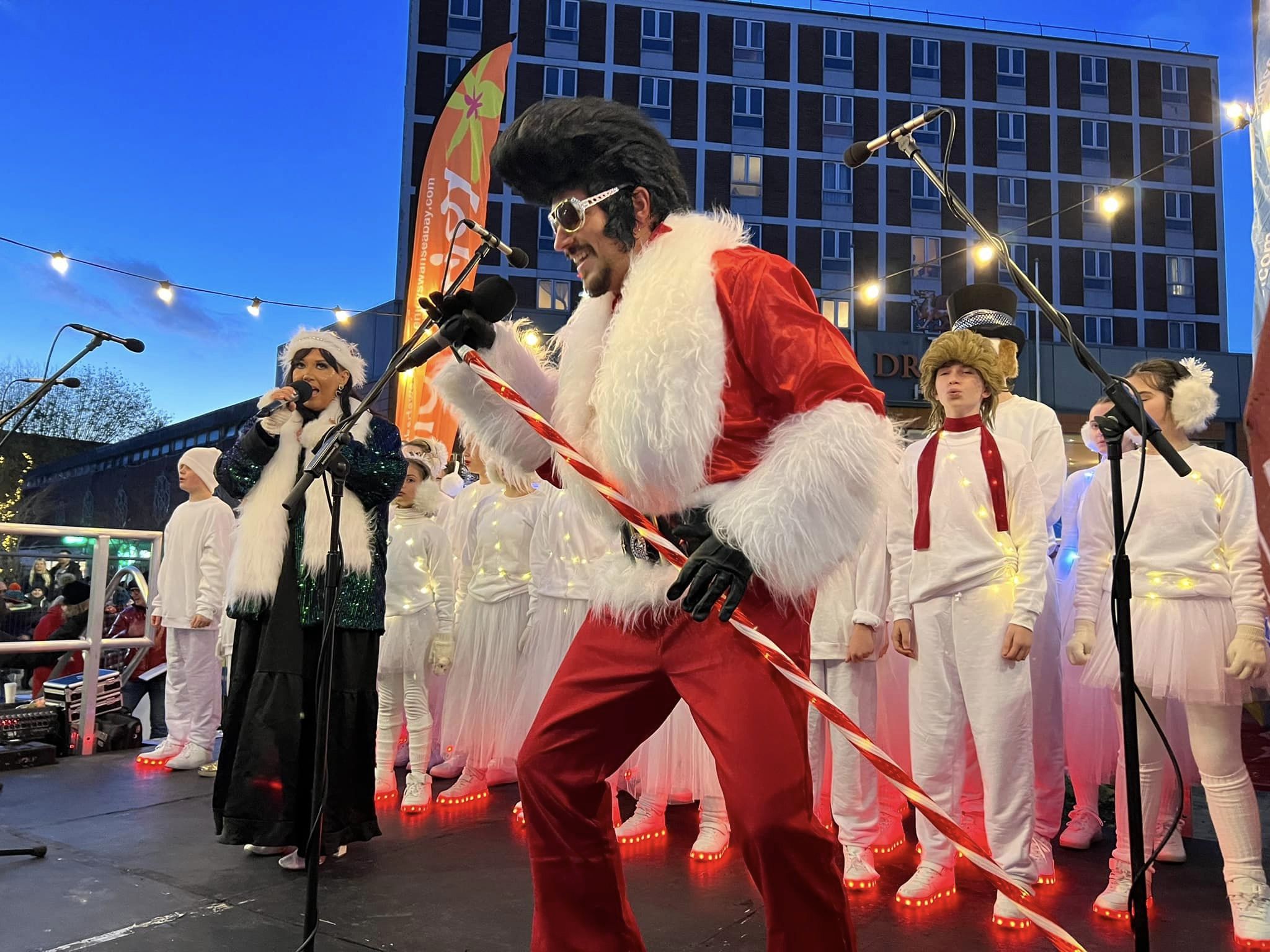 Stefan Pejic performing as 'Quiffmas' at Swansea Christmas Parade 2022