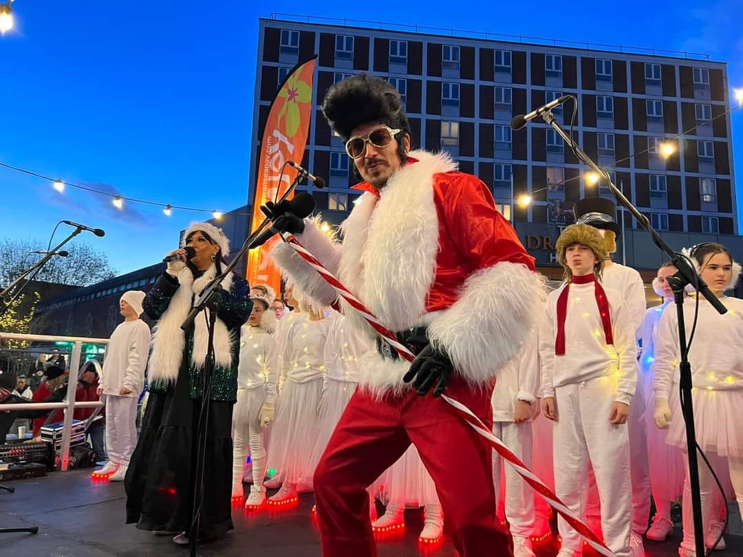 Stefan Pejic performing as 'Quiffmas' at Swansea Christmas Parade 2022